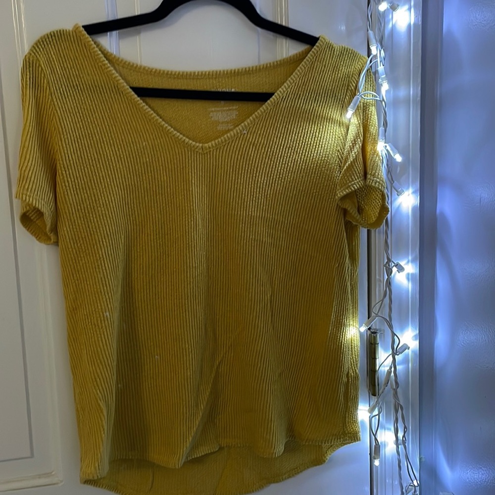 Yellow shirt.